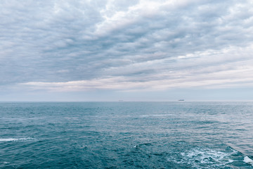 Cold blue sea landscape with overcast sky