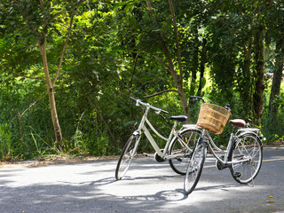 Fototapeta na wymiar Two bicycles parking on local road