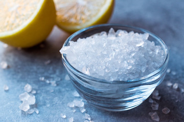 Lemon Sea Salt Crystals on Blue Surface.