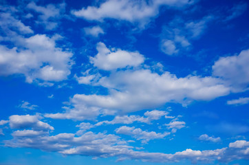 Naklejka na ściany i meble gentle white clouds in a bright blue spring sky