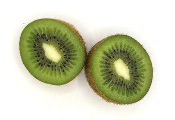 Fototapeta premium fresh organic heap of cut green kiwi isolated on white background, slices, the taste is sour and sweet , from the garden, good health, can make smoothie in summer with front view