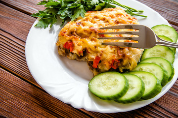 Pork chop with cheese and red pepper 