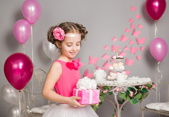 Child Girl holding Present Gift Box, Happy Kid Celebrating Birthday Party, Retro Style decoration