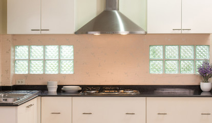 Modern style kitchen counter with cabinet  stove chimney hood and washbasin