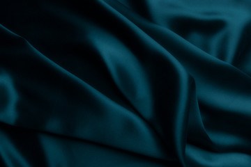 Elegant blue satin silk with waves, abstract background