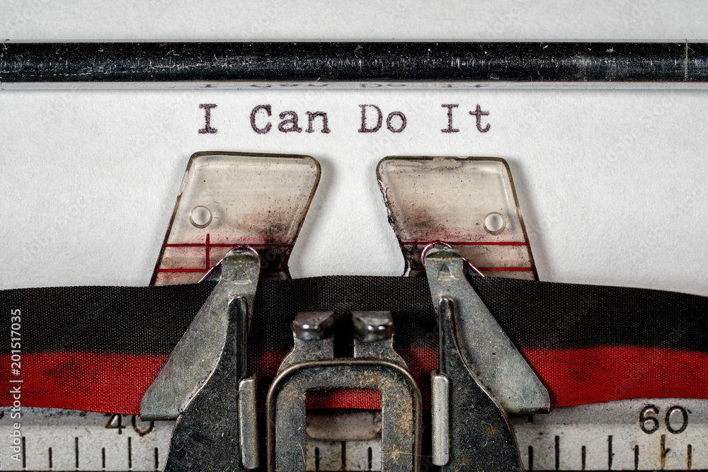 Poster macro of the ribbon and paper of typewriter with positive confident message