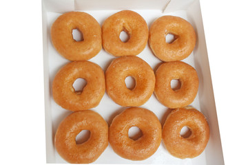 Fresh donuts in white paper box background , take away food