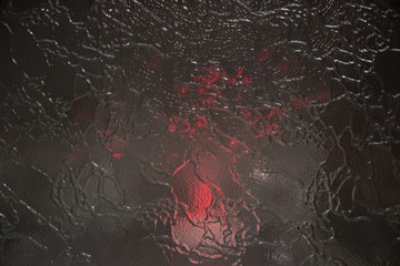 Behind the glass red light