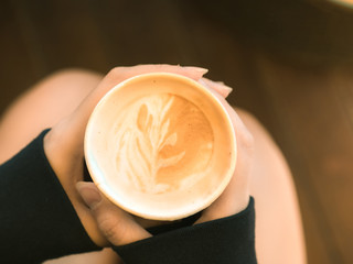 business and coffee break concept from coffee with beauty decorate and hold by woman hand in the morning time with soft focus background