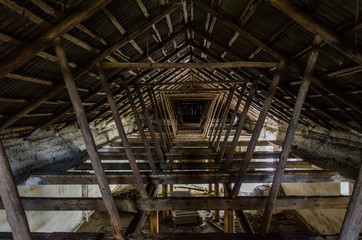 The roof of the building. The rafter system rests on the walls