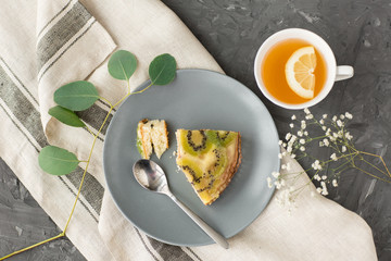 pie on a plate and tea with lemon