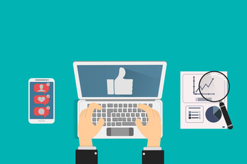 community manager reviews posts on social networks and compares statistics of marketing campaigns on her smartphone and her computer, concept of social media