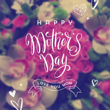 Happy mother's day - Greeting card. Brush calligraphy greeting and hand drawn hearts on a blurred flowers background. Vector illustration.