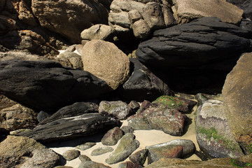 Abstract beautiful nature of white sand and hole of rock near the beach.