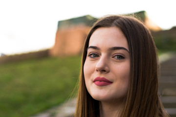 Young girl portrait in city in spring