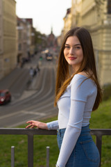 Young girl portrait in city in spring