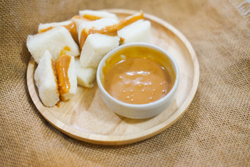 Pieces of steamed bread with Thai tea custard