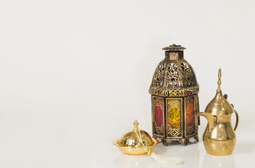 Fototapeta na wymiar Unique old lantern with Arabic coffee pot