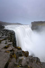 Dettifoss is a waterfall in Vatnajokull National Park in Iceland, and is the most powerful waterfall in Europe. Amazing landscape at sunrise.