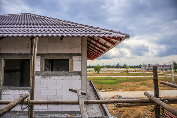 Fototapeta premium construction residential new house in progress at building site