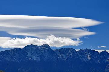 Lenticular clouds over the mountains at Queenstown, New Zealand