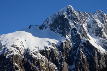 Fototapeta na wymiar Glacier covered mountain peak, Fiordland National Park, South Island, New Zealand