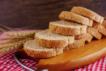 Sliced breads in wooden plate Food,bakery concept 