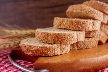 Sliced breads in wooden plate Food,bakery concept 