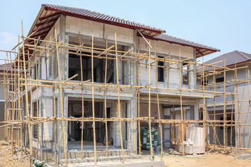 house under construction with autoclaved aerated concrete block structure at building site