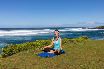 Naklejka na ściany i meble Woman Practicing Maui on the Scenic Maui Coast