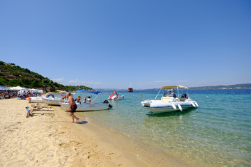 Fototapeta na wymiar A beach and small boats in shallow water