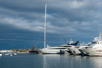 Nice view of the luxury boats in the port of Valencia Spain with the blue sky and clouds