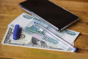 Business still life, money, pen and smartphone
