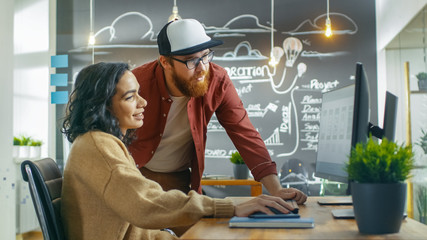 At the Desk Beautiful Woman Developer Talks With Programer, Together They Design New Mobile Game/...