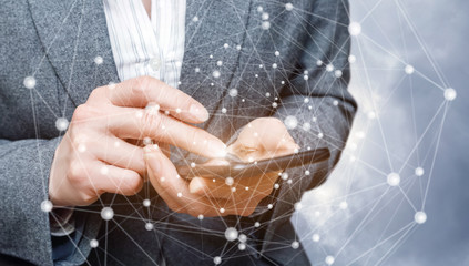 Businesswoman working on mobile phone network .