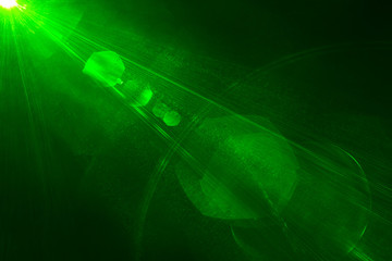 Camera lens flare by laser light create hexagons of objective iris shapes of number depending on number of lens surface and interferent effect and moire on digital sensor on dark black background