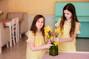Happy girls at dawn indoor