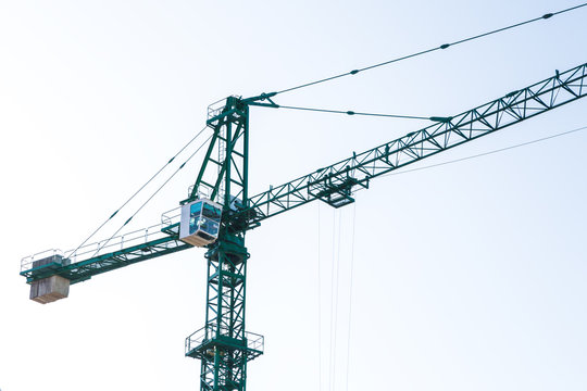green construction crane, close-up photo, background image