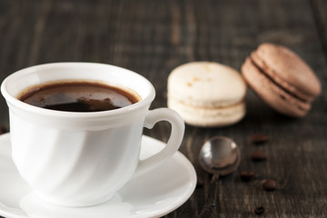 a cup of coffee and macaroons