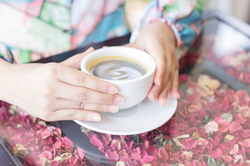 Woman drinking coffee at coffee shop