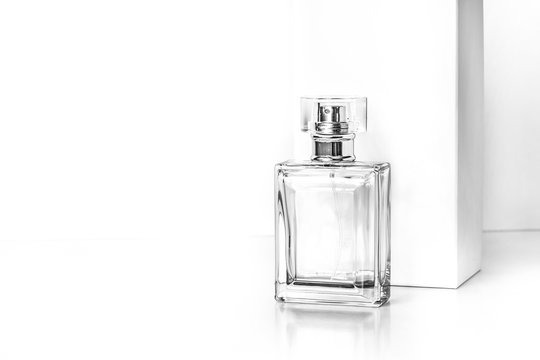 Perfume Bottle In Front Of White Box