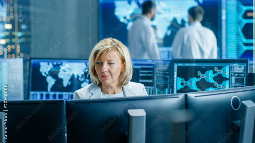 Fototapete System Monitoring Room Professional Female Operator Observes Correct Functioning of the Facility. In the Background People Working with Interactive Map.