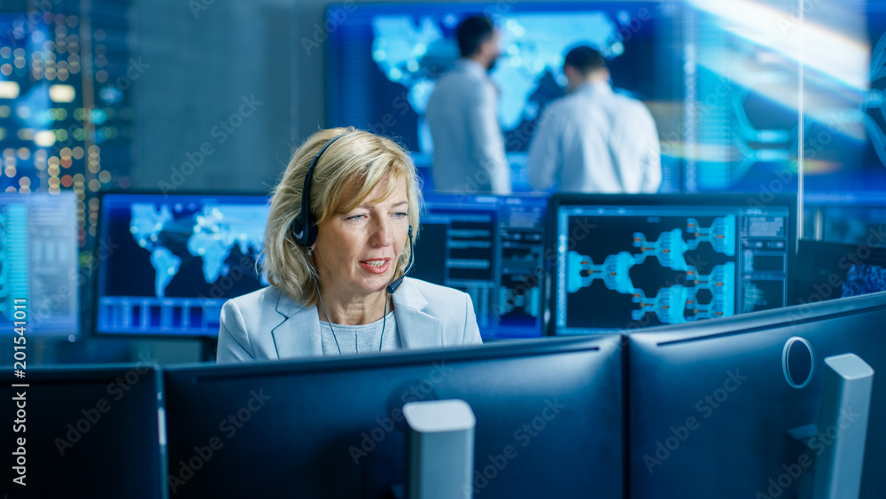 Poster System Monitoring Room Female Dispatcher Control Correct Functioning of the System. In the Background People Working with Interactive Map.