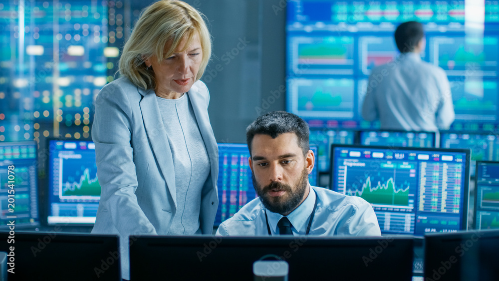 Poster in the stock market firm head of the department talks with professional trader. they're surrounded b