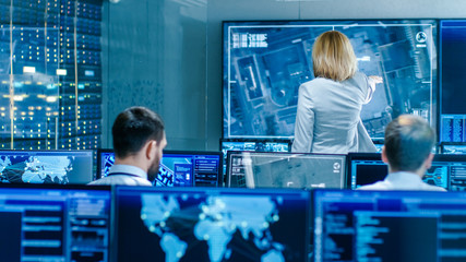In the Government Surveillance Facility Team of Officers Organize Interception Plan with Help of...