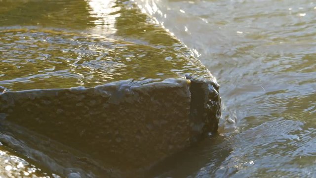 Water Hitting The Rocks At Sunrise