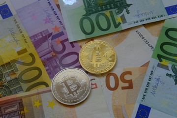 Euro in banknotes and coin bitcoin