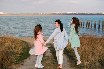 Happy family, mom and daughters