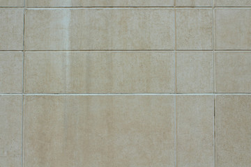 Fototapeta premium Concrete wall made of large flat tiles. Background. Texture.