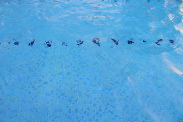 Beautiful blue transparent water in the pool. Background. Texture.